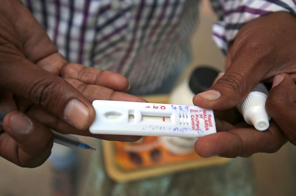 PHOTO: A health worker shows a malaria rapid test kit after collecting blood sample from a resident during a drive to prevent the spread of mosquito-borne diseases in Ahmedabad, India, Oct. 26, 2018.