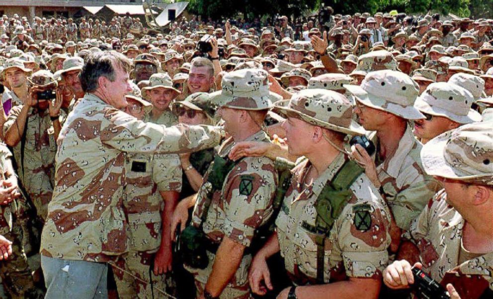 PHOTO: President George Bush reaches out to shakes hands with Marines gathered at the U.S. Embassy, Dec. 31, 1992.