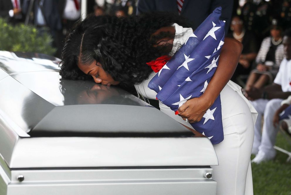 PHOTO: Myeshia Johnson kisses the casket of her husband U.S. Army Sgt. La David Johnson during his burial service at the Memorial Gardens East cemetery, Oct. 21, 2017, in Hollywood, Florida.