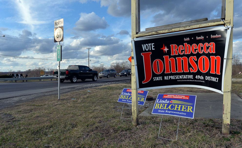PHOTO: Campaign signs for both candidates for Kentuckys 49th District, Republican Rebecca Johnson and Democrat Linda Belcher, share space on a road in Shepherdsville, Ky., Feb. 20, 2018.