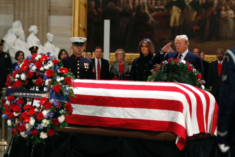 PHOTO: President Donald Trump and first lady Melania Trump pay their respects to former President George H. W. Bush, as he lies in state in the Rotunda of the U.S. Capitol, Dec. 3, 2018.