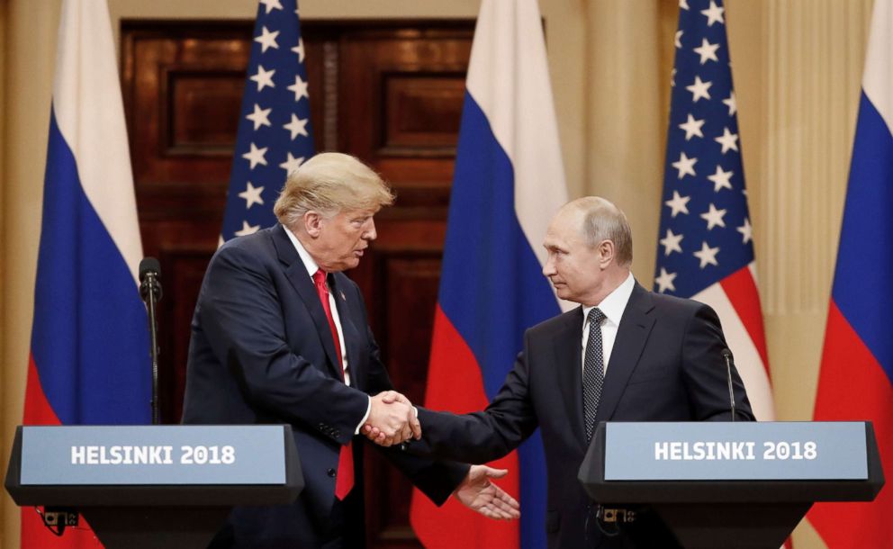 PHOTO: President Donald Trump and Russian President Vladimir Putin shake hands as they hold a joint news conference after their meeting in Helsinki, Finland July 16, 2018.