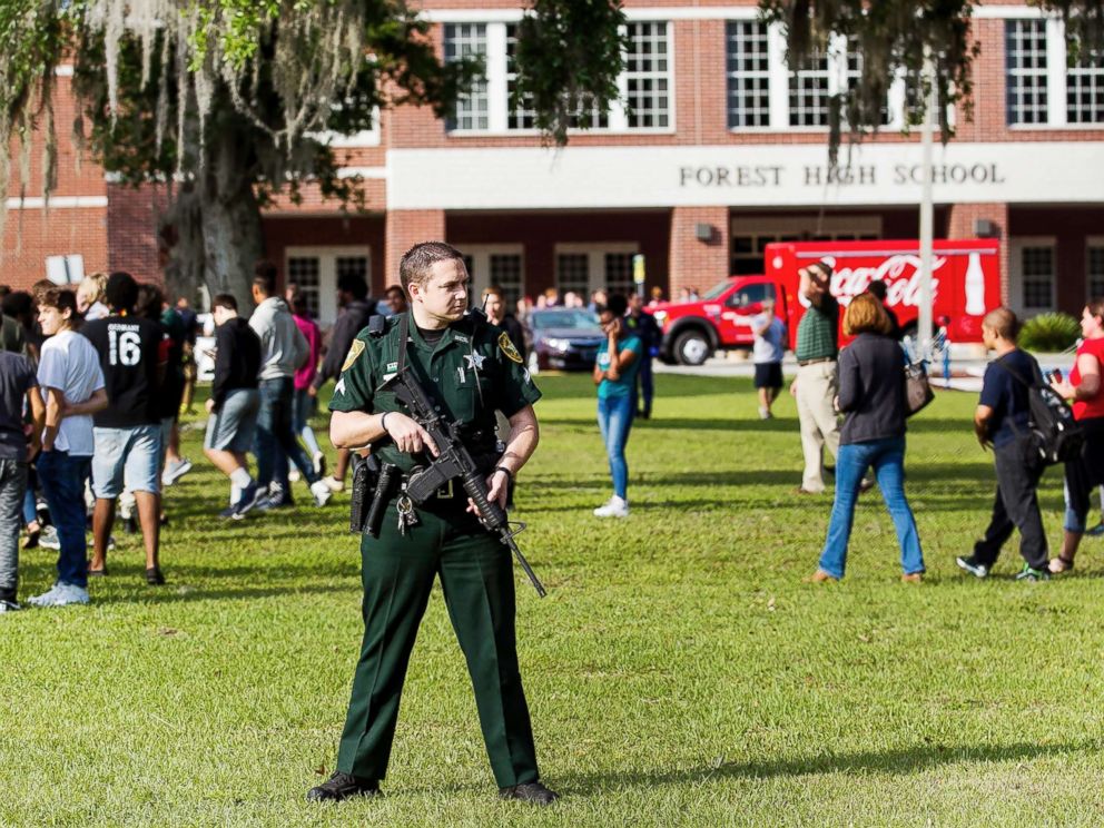 PHOTO: A Marion County Sheriffs Deputy stands outside Forest High School as students exit the school after a school shooting occurred on April 20, 2018 in Ocala, Fla.