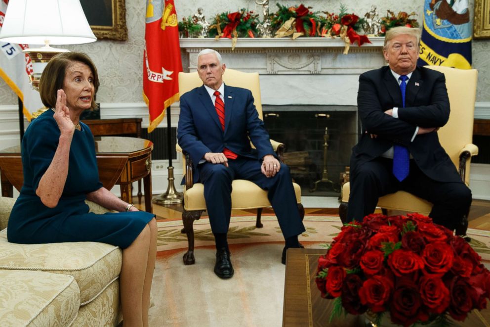 PHOTO: Vice President Mike Pence listens as President Donald Trump argues with House Minority Leader Rep. Nancy Pelosi during a meeting in the Oval Office of the White House, Dec. 11, 2018, in Washington.